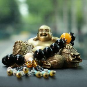 Tượng Di Lặc bằng đồng để oto may mắn