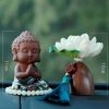 Bộ tượng Phật bên hoa sen để trên ô tôBộ tượng Phật bên hoa sen để trên ô tô